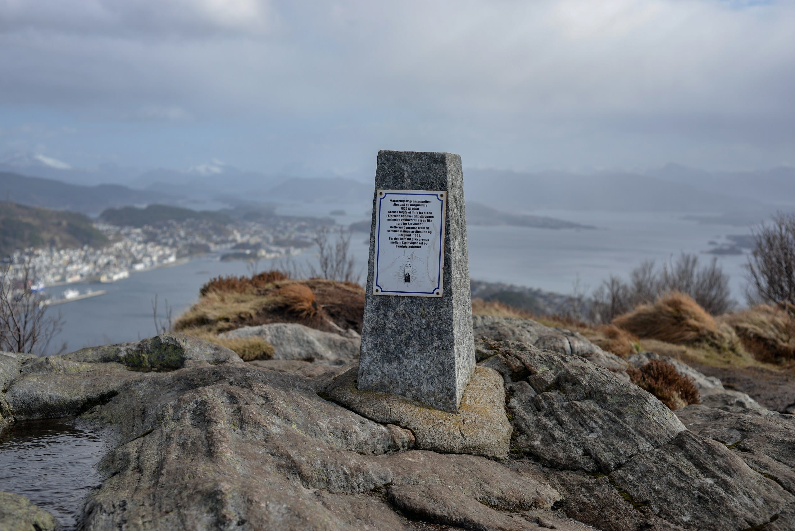 The Fjellstua viewpoint on Aksla hill overlooking Ålesund's harbour and Art Nouveau rooftops under a cloudy sky