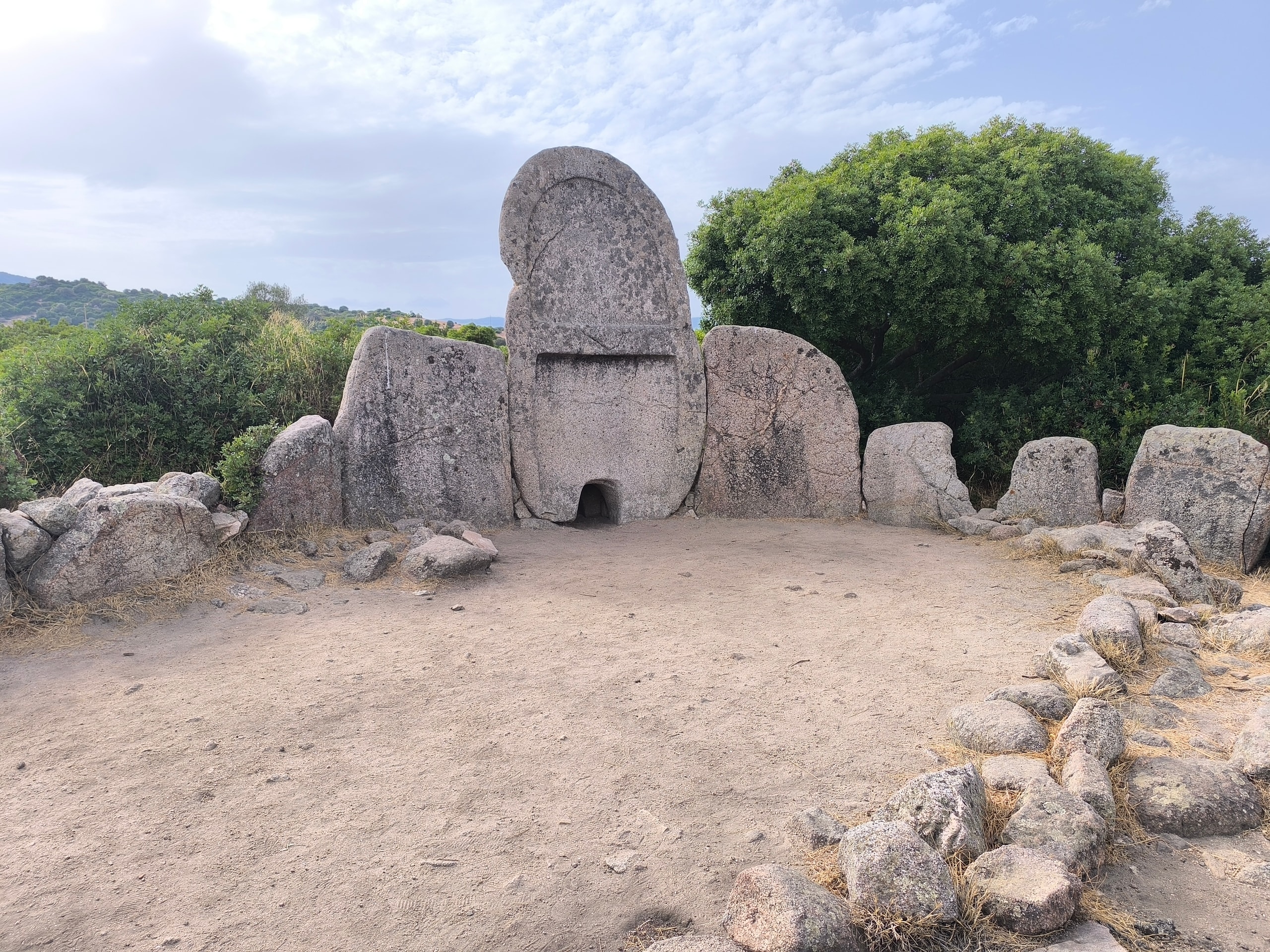 The granite stele and semicircle of standing stones at the Coddu Vecchiu giants’ tomb near Arzachena
